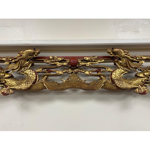 592 - Chinese carved and gilded door frame, carved throughout with dragons, bats, cranes, lotus flower and... 