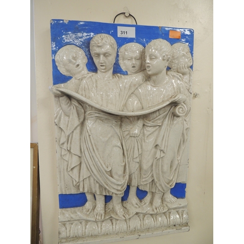 311 - Glazed bas relief pottery plaque of choristers, in the style of Della Robbia, 47cm x 30cm