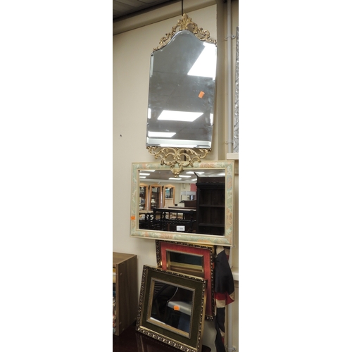 335 - Four decorative wall mirrors, the largest 76cm high