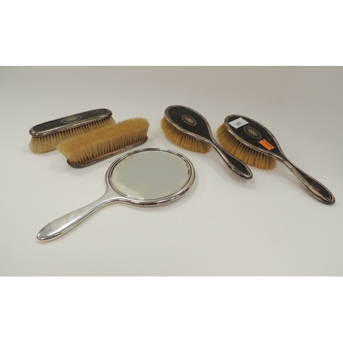 167 - George V silver and tortoiseshell vanity set, Birmingham 1917, comprising hand mirror, two hairbrush... 