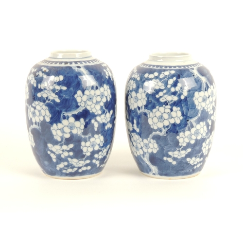 11 - Pair of Chinese blue and white prunus pattern ovoid jars, late 19th Century, painted four character ... 