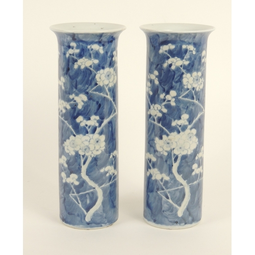 12 - Pair of Chinese blue and white prunus pattern cylinder vases, late 19th Century, four character Kang... 