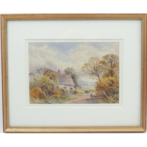 125 - Frank Gresley (1855-1936), Figure before a country cottage, watercolour, signed, 18.5cm x 27cm