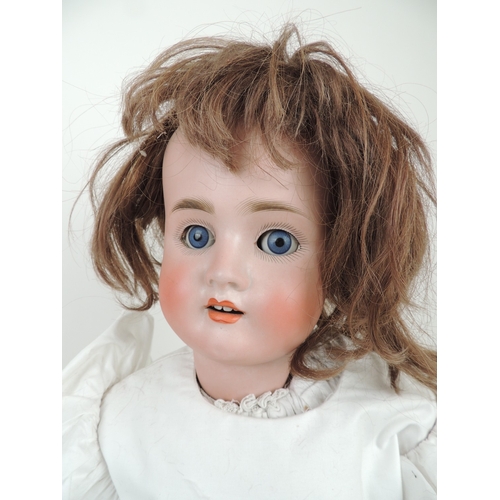 206 - Schoenau and Hoffmeister bisque headed doll, mould mark '1906/14', rolling glass eyes with painted l... 