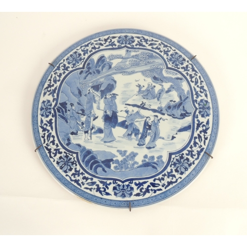 36 - Chinese blue and white circular plaque, late 19th or early 20th Century, decorated with a sage with ... 