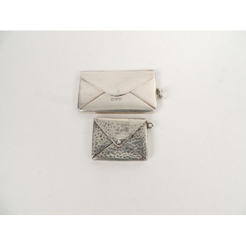 412 - Two Edwardian silver stamp envelopes, one of plain form, Chester 1908, 4.5cm, the other with a hamme... 