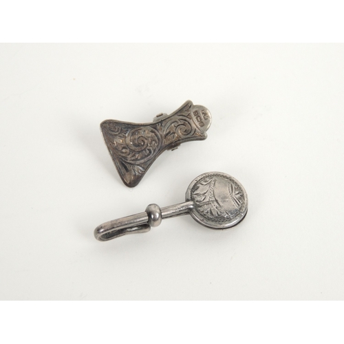 415 - George V silver napkin clip, Birmingham 1911; and another with scroll engraved decoration, Birmingha... 