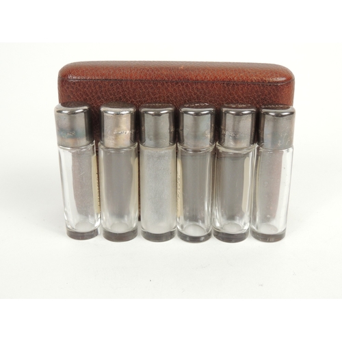 416 - Set of six silver capped pill bottles, maker HWL, Birmingham 1909, each with screw cap and clear cyl... 