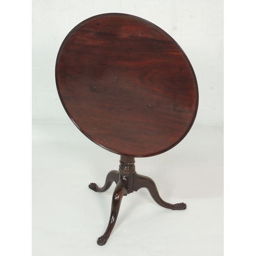 580 - George III mahogany dished top tilting tripod table, 74cm diameter top on a gun barrel column, splay... 