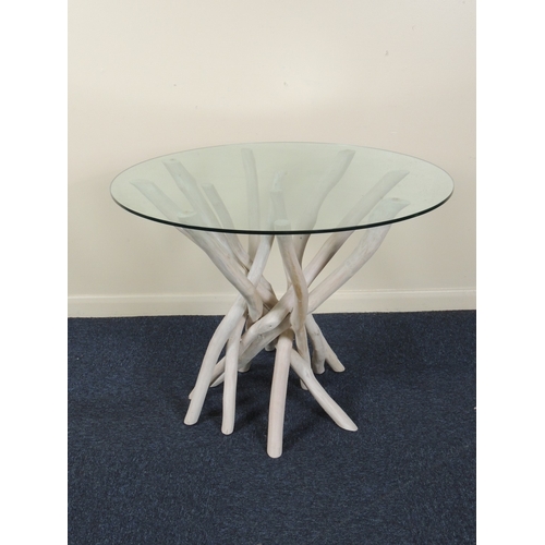 639 - Decorative modern plate glass topped table with driftwood style wooden cluster base, 100cm diameter