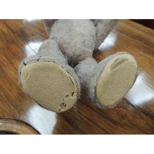 198 - Vintage plush teddy bear with swivel head and short tail, original glass eyes, 33cm