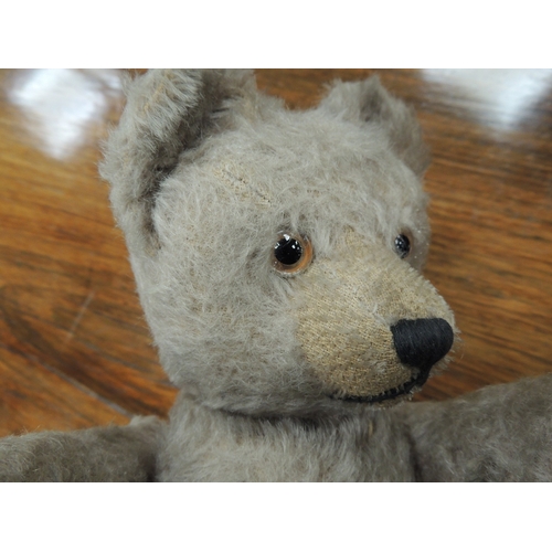 198 - Vintage plush teddy bear with swivel head and short tail, original glass eyes, 33cm