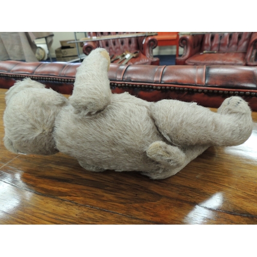 198 - Vintage plush teddy bear with swivel head and short tail, original glass eyes, 33cm