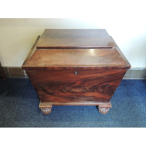 579 - William IV mahogany sarcophagus wine cooler, circa 1835, with lion's mask ring handles, turned feet ... 