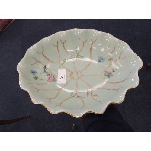 31 - Chinese celadon dish, late 19th Century, detailed as a lotus leaf with famille rose details, printed... 