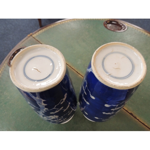 10 - Pair of Chinese blue and white prunus pattern vases, late 19th Century, tapered, shouldered cylinder... 