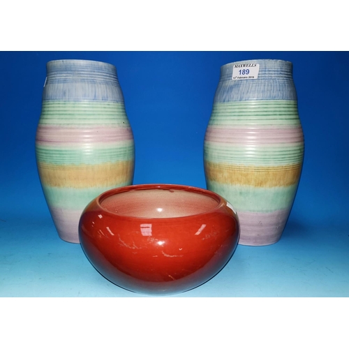 189 - A pair of mid 20th century Beswick vases stamped 128, a red glazed Bretby bowl
