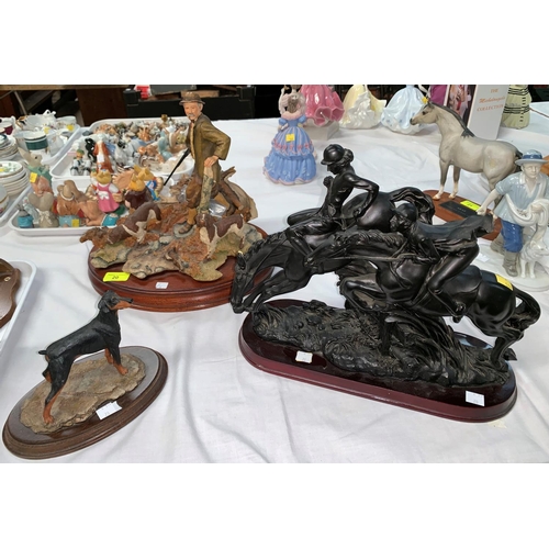 20 - A Sherrott Simpson resin group hunter with dogs, signed; a similar figure of a Doberman; A resin gro... 