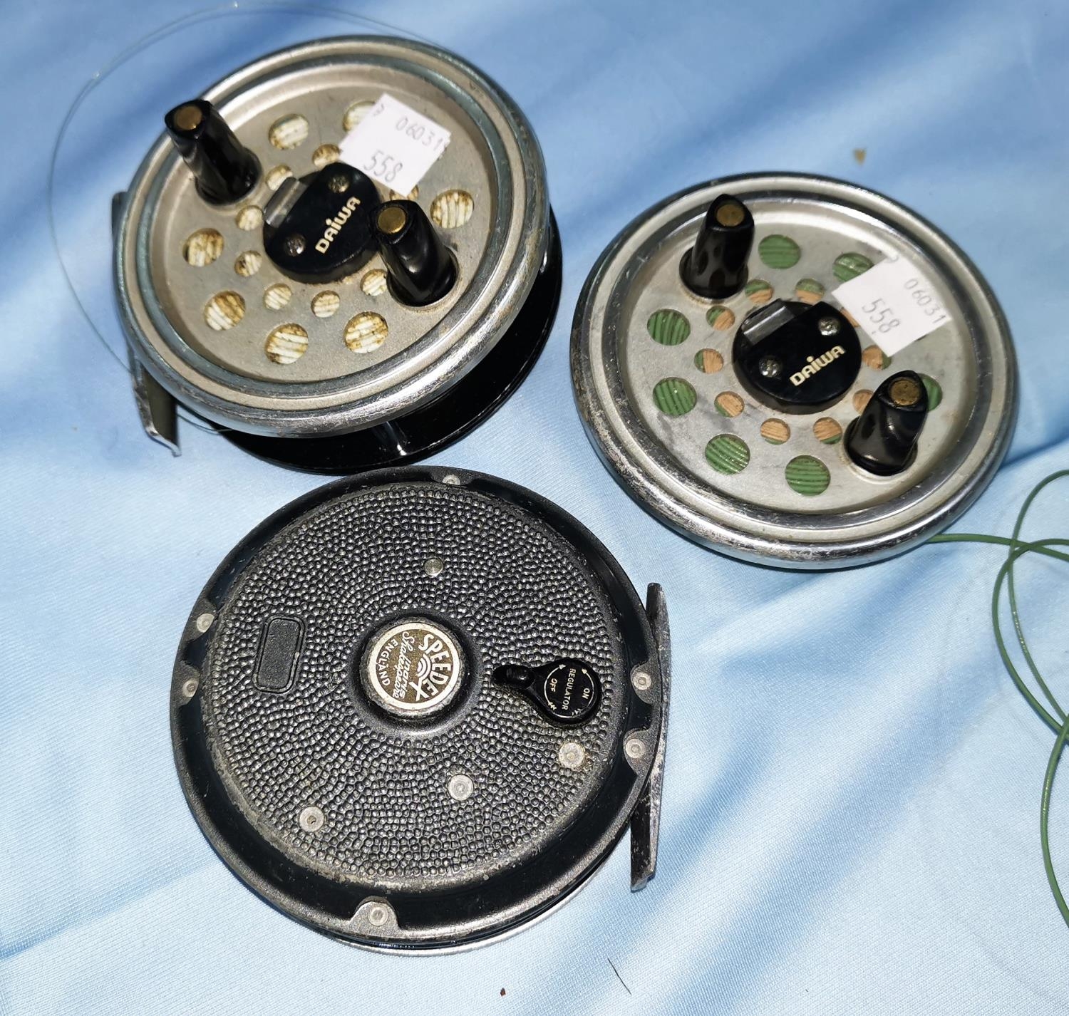 A DAIWA 732 fly reel with spare spool and another reel (a.f.)