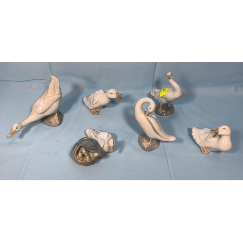38 - A Lladro group, duck & ducklings; 2 Lladro geese; 3 Nao geese