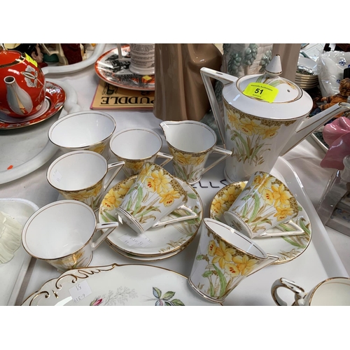 51 - A Royal Standard bone china daffodil pattern coffee set (pot a.f.) and a similar paragon part set