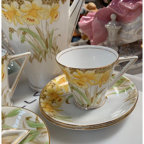 51 - A Royal Standard bone china daffodil pattern coffee set (pot a.f.) and a similar paragon part set