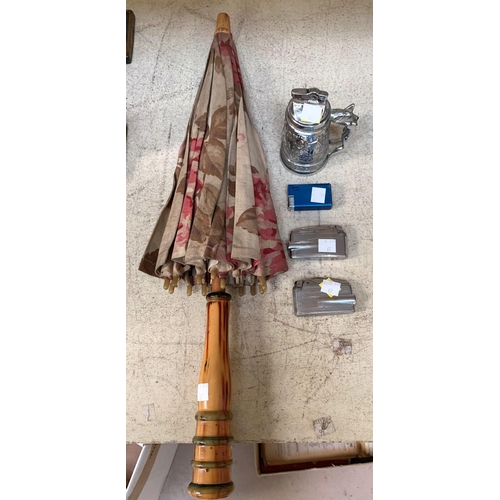 67 - A vintage table lighter and 4 others; a vintage parasol and 1930's chiming mantle clock