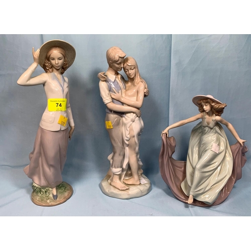 74 - A Lladro figure girl in hat; a Lladro figure girl dancing (2 fingers a.f.); a Lladro style group of ... 