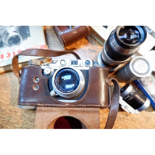 498 - A LEICA III camera No 328058 with Summar 50mm 1.2 lens No 409142 in E.R. leather case, a LEITZ ELMAR... 