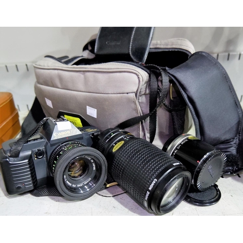 493 - A CANON T70 35mm SLR camera with 50mm 1.8 lens, a Canon Zoom Lens 75-200 4.5 and a Vivitar MC tele c... 