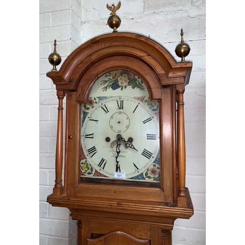 605 - A 19th Century longcase clock, arch top hood with turned pillars and brass finials, quarter reeded c... 