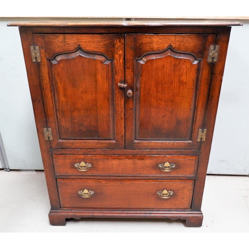 607 - A Reproduction distressed oak TV/side cabinet in the manner of Tichmarsh and Goodwin with double cup... 