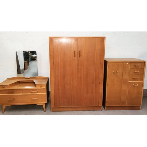 612 - A Gomme/G-Plan Brandon mid 20th century three piece bedrooom suite in light oak comprising gents com... 