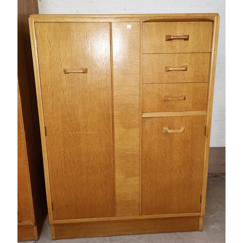 612 - A Gomme/G-Plan Brandon mid 20th century three piece bedrooom suite in light oak comprising gents com... 
