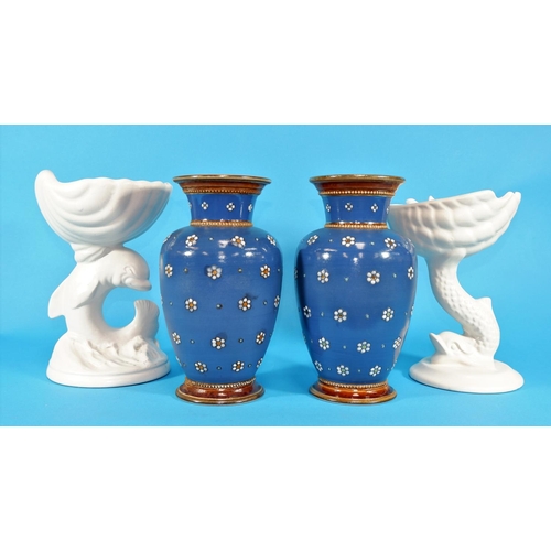 156 - A pair of Metlach stoneware baluster vases decorated with flowerheads on a blue ground; 2 white pede... 