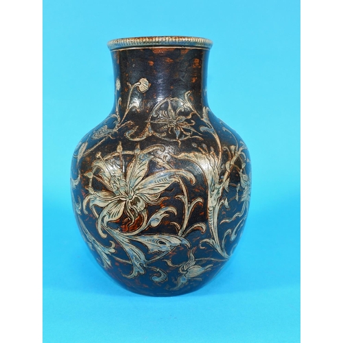 169 - A stoneware bulbous vase by Martin Brothers, with incised decoration of scrolling orchids, blue on b... 