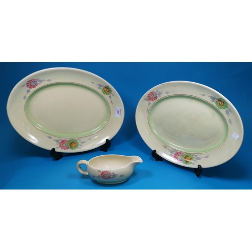 190 - Two oval graduating meat plates and a gravy boat by Clarice Cliff, decorated with poppies (smaller m... 