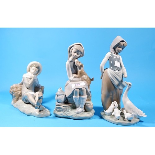 226 - Three Lladro groups:  girl with dog; girl with ducklings & reclining boy