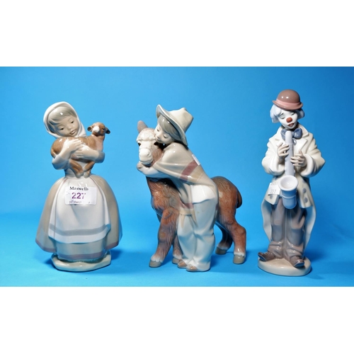 227 - A Nao figure of a girl with calf; A Lladro boy with donkey (minor chip to hat rim) & a clown with sa... 