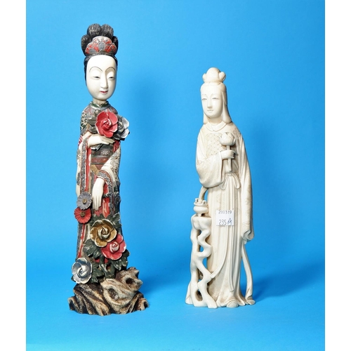 235a - An early 20th century oriental ivory figure, female deity with lotus blossom, signature to base, hei... 