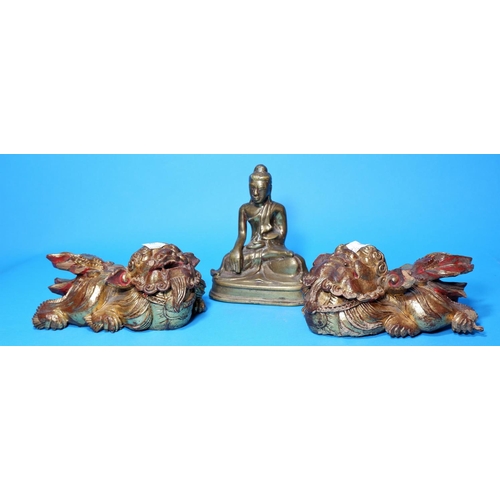 237 - Two Chinese dogs of Fo in gilt and carved wood, length 6; a brass Buddha, height 6