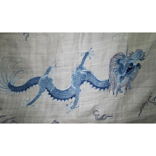 241a - A Chinese linen tablecloth decorated with 2 dragons in blue embroidery
