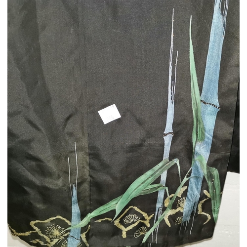 244A - A black silk kimono, lined and decorated with bamboo; 2 black tasselled ties; a long floral wrap