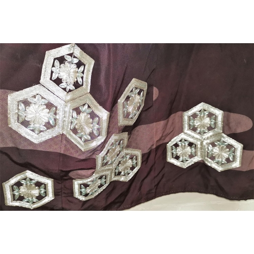 244 - A Japanese plum coloured kimono decorated with hexagonal panels in silver thread embroidery