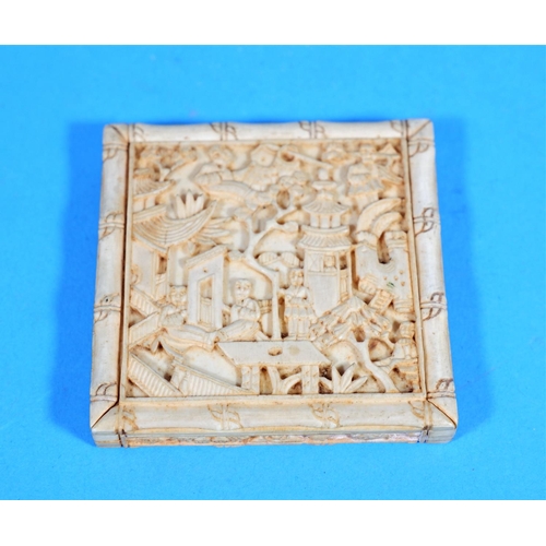 246 - An early 20th century Chinese box in carved ivory with extensive relief decoration, length 2.75