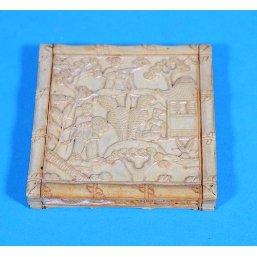 246 - An early 20th century Chinese box in carved ivory with extensive relief decoration, length 2.75