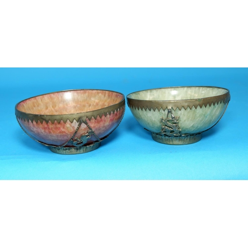 252 - A Chinese pair of polished crystalline stone bowls with white metal mounts,  seal marks to base, dia... 