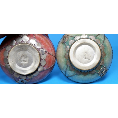 252 - A Chinese pair of polished crystalline stone bowls with white metal mounts,  seal marks to base, dia... 