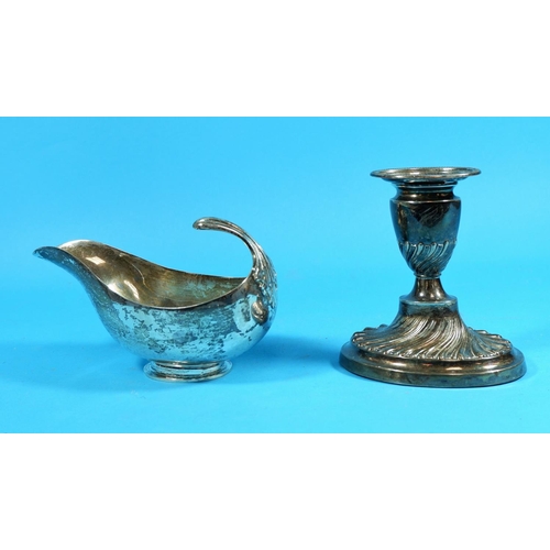 306 - A silver Neo-classical style sauce boat, Birmingham 1937, 6.25 oz; a silver Adam style candlestick (... 
