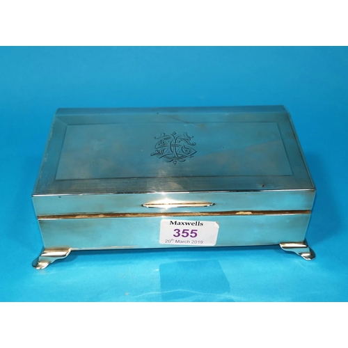355 - A silver cigarette box, engine turned with slope front, monogrammed, London 1924